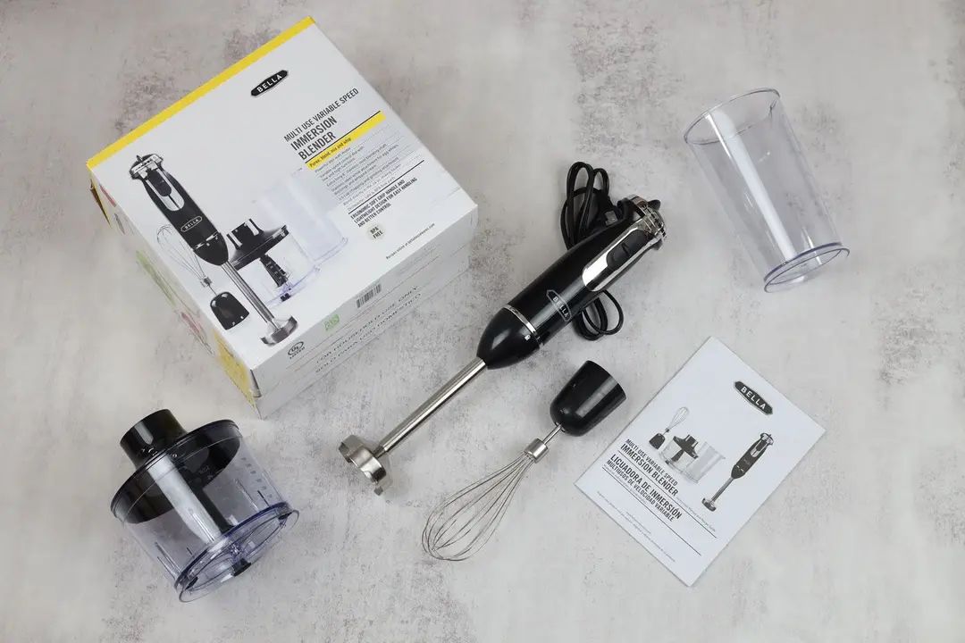 The BELLA Stick Blender is shipped with a paper carton box, an immersion blending wand, a motor body, a plastic beaker, a whisk attachment, a food processor, and a user manual.