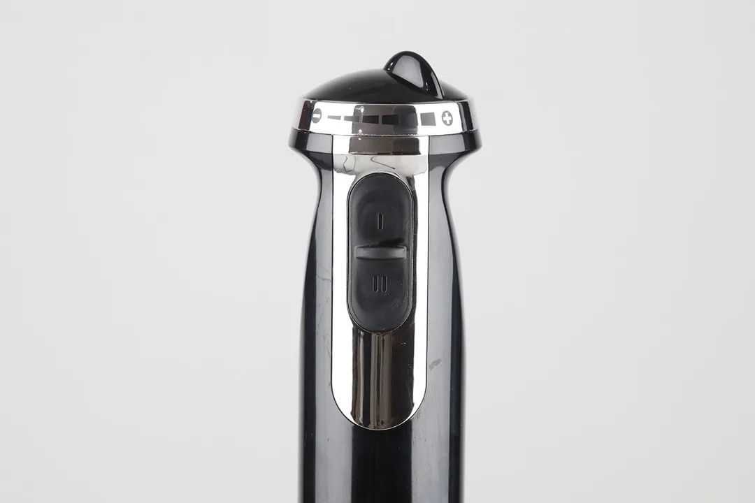 A close-up of the two speed control buttons of the BELLA immersion blender. 