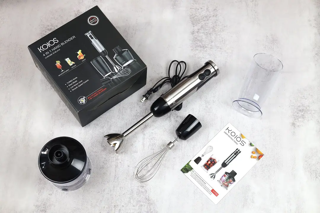 The KOIOS 4-in-1 Stick Blender is shipped with a paper carton box, an immersion blending wand, a motor body, a plastic beaker, a whisk attachment, a food processor, and a user manual.
