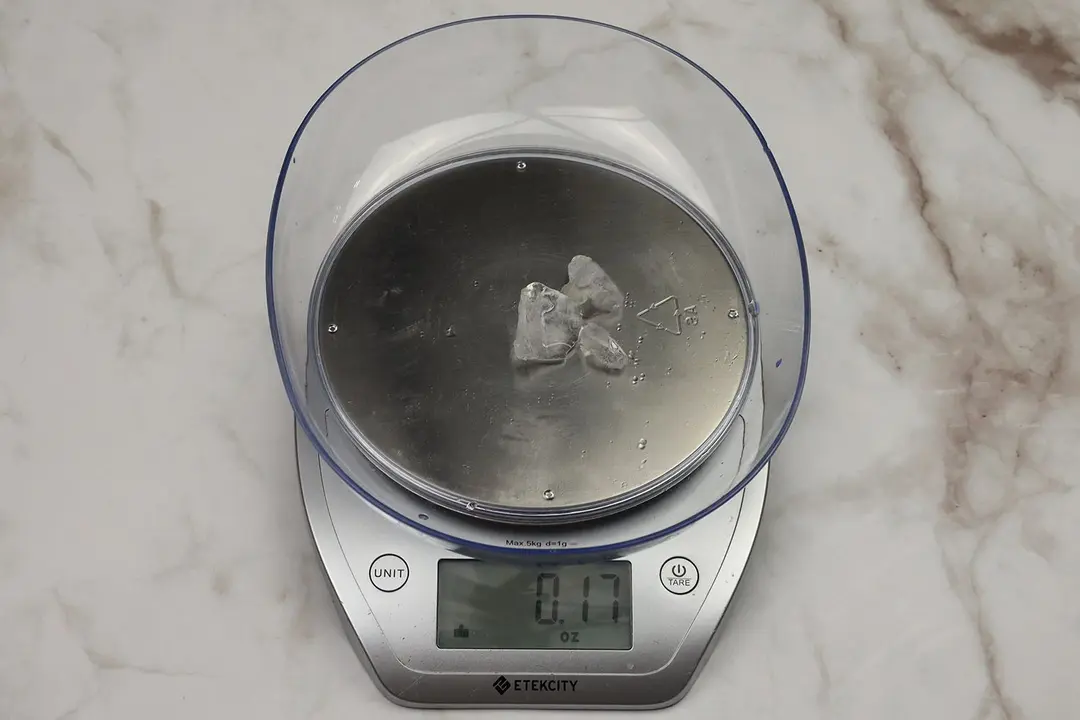 The amount of unblended ice cubes (0.17 oz) of the NutriBullet single-serve blender displayed on a scale’s screen.