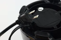 A close-up of the power plug in the underside of the Black+Decker Fusionblade motor base.