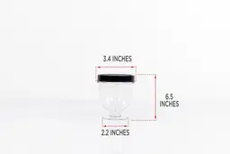 The blending cup of the KOIOS Bullet personal blender standing on a table with dimension measurements written to the side (3.4x6.5x2.2 inches). 