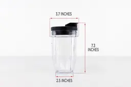 The blending cup of the Magic Bullet personal blender standing on a table with dimension measurements written to the side (3.7x7.3x2.5 inches). 