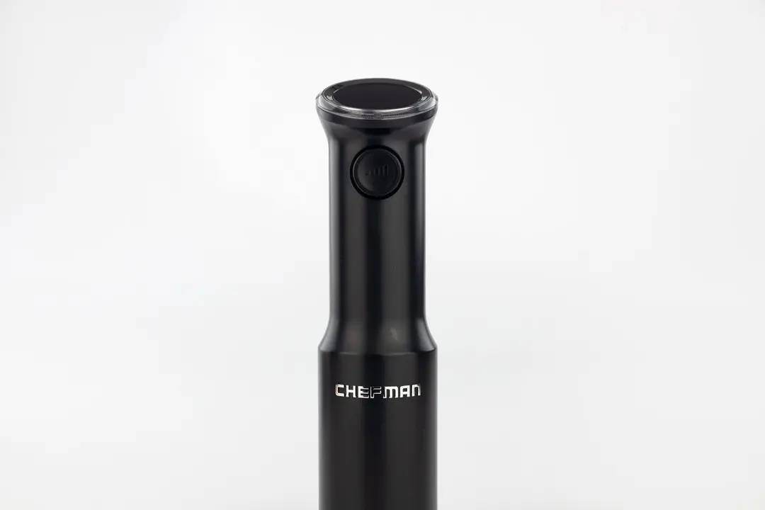 A close-up of the variable speed control button on the front interface of the Chefman cordless stick blender.