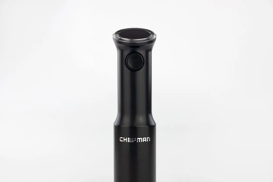 A close-up of the variable speed control button on the front interface of the Chefman cordless stick blender.