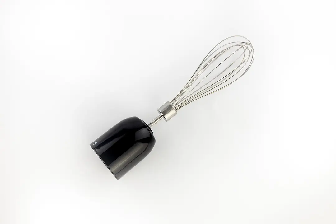 The Chefman 6-in-1 Immersion Blender Whisk Attachment lying flat on a white table.