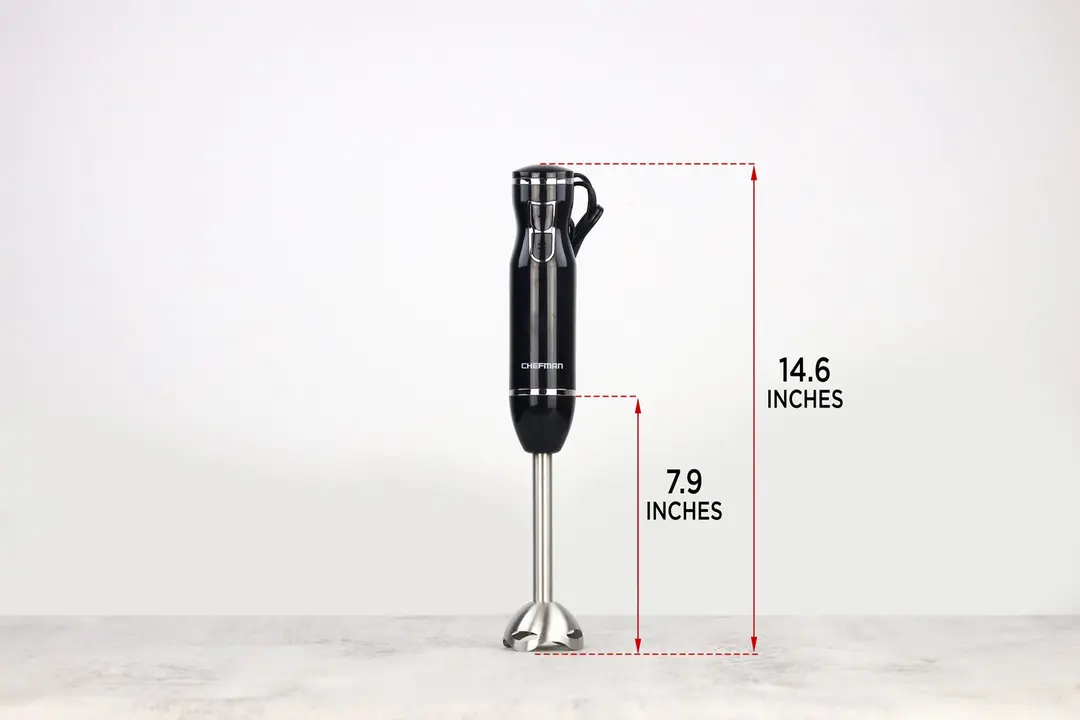 The Chefman hand-held blender standing on top of its blending shaft on a gray table, with the length of the blending shaft being noted to the side as 7.9 inches, and the total length of the unit as 14.6 inches.