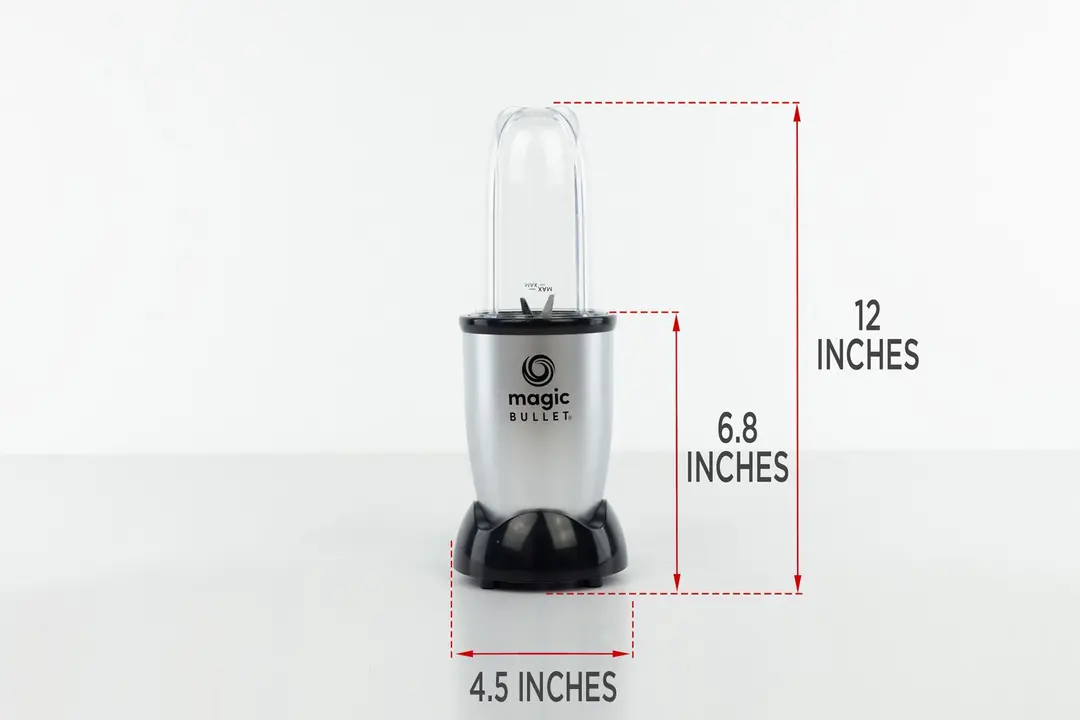 The Magic Bullet Smoothie Maker personal blender standing on a gray table, with the length of its motor base being noted to the side as 6.8 inches, and the total length and width of the unit as 12 inches and 4.5 inches, respectively.