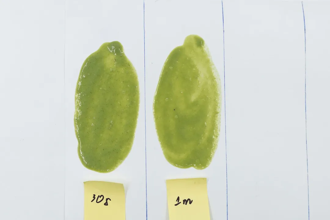 Two spoons of Vitamix 5200’s green smoothie were spread evenly on a white paper with blending times of each indicated below (30 seconds and 1 minute).