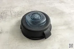 The Vitamix E310 two-part lid stands on a table