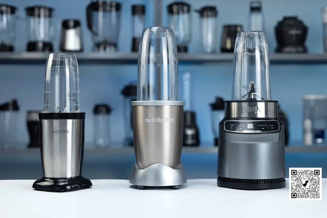 Our best bullet blenders, including the KOIOS, NutriBullet, and Ninja BN401 personal blender, are standing on a table. Different machines are in the background.