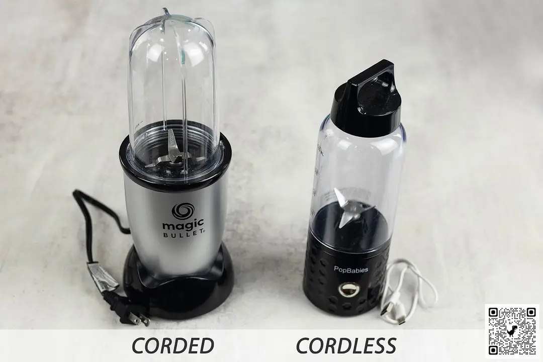Two personal blenders are standing on a table.