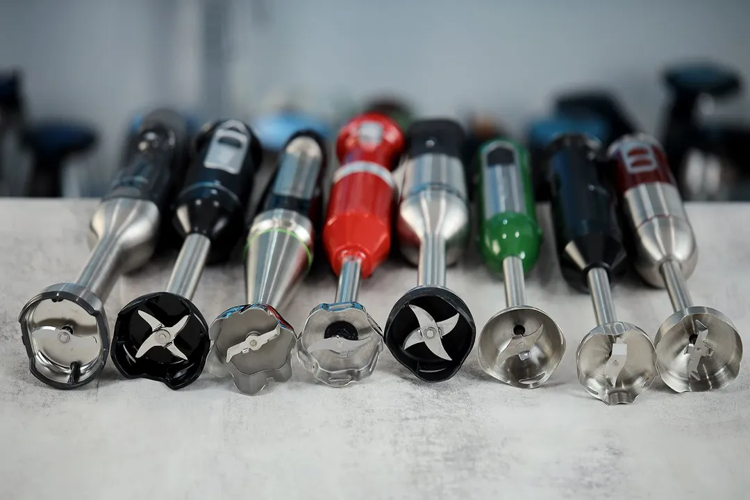 A collection of immersion blenders with different blade designs.