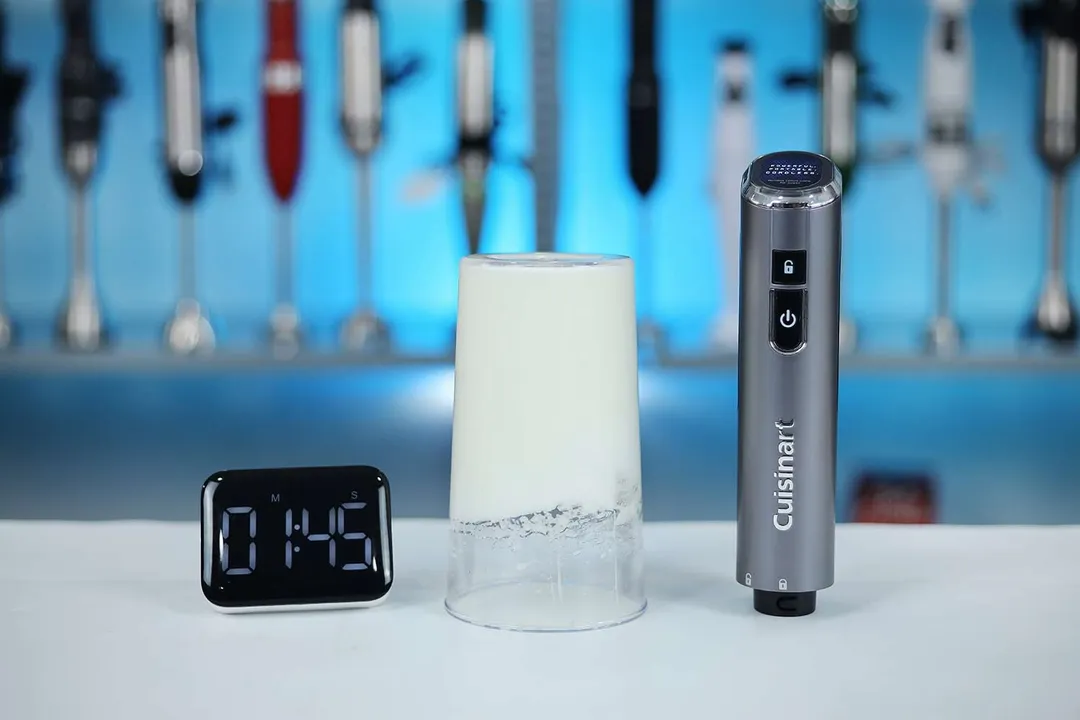 The performance of the Cuisinart cordless immersion blender is tested with whipped egg whites, as evidenced by the timer set at 1:45, indicating the duration of the test.