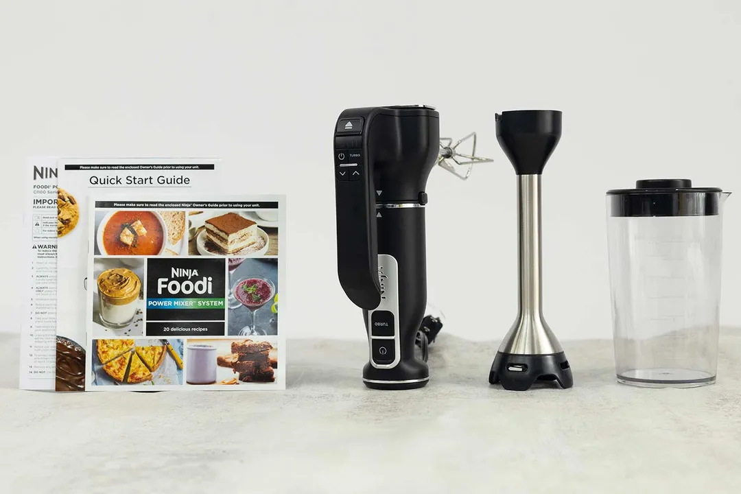 A Ninja CI101 Foodi Power Mixer System with its accessories and a Quick Start Guide.
