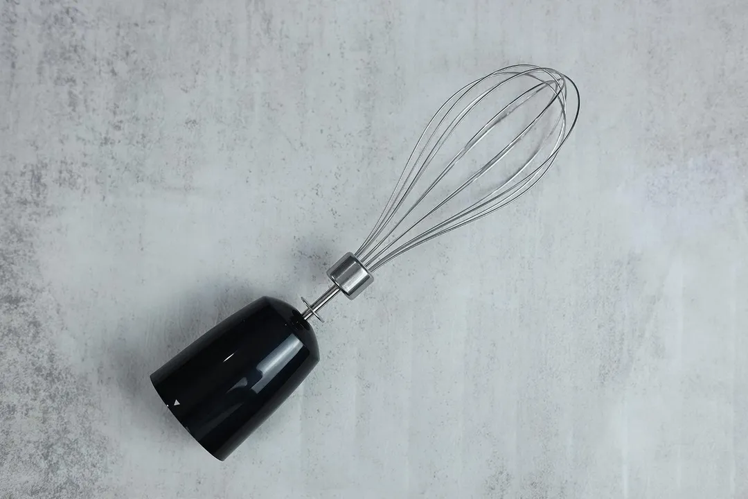 A close-up of the whisk attachment of the Keylitos 5-in-1 immersion blender. 