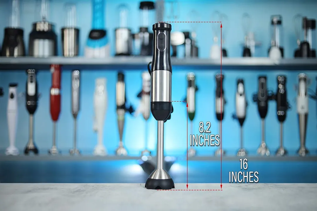 The LINKchef hand-held blender standing on a table, with the length of its blending shaft being noted to the side as 8.2 inches, and the total length of the unit as 16 inches. 