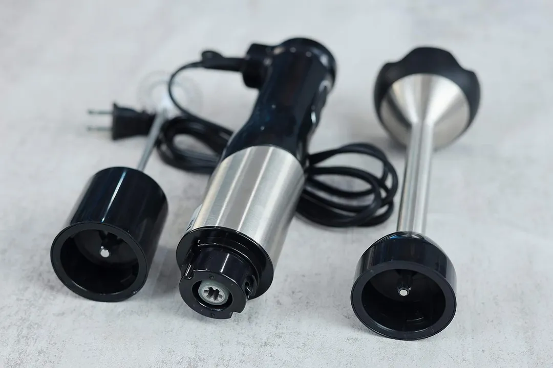 A close-up of the blending wand, milk frother, and motor housing of the LINKchef immersion blender. 