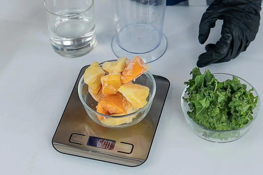 Smoothie ingredients being weighed on a kitchen scale