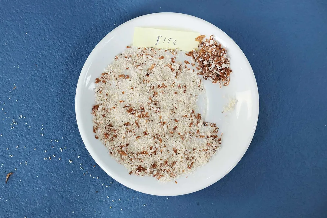 Plate labeled Elite Gourmet containing almond particles