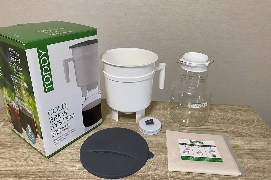 The unboxed contents of the Toddy Cold Brew System. Pictured is the brew vessel, glass carafe, and filtration system.
