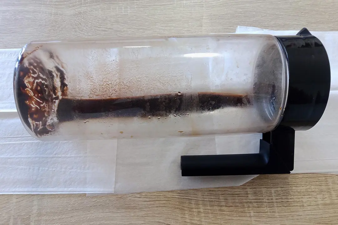 The Takeya cold brew coffee maker with the filter removed and all the brew decanted. Inside is the remaining sediment.