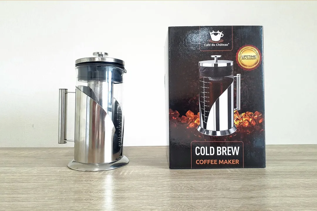 The Cafe du Chateau cold brew coffee maker standing to the right of its box.