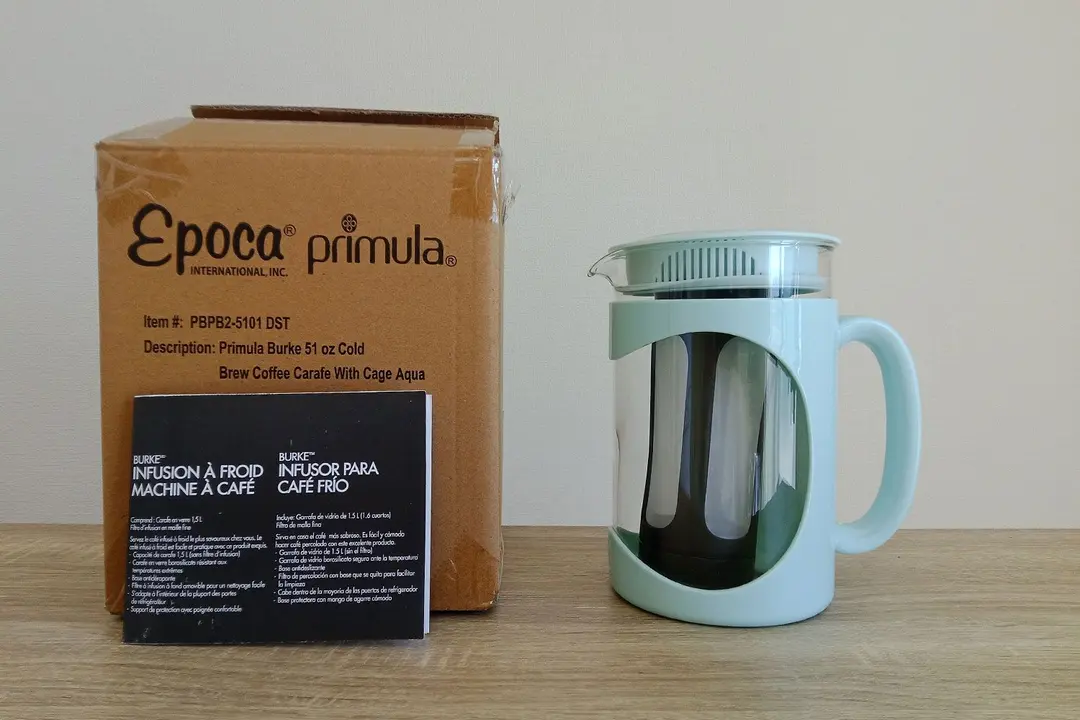The unboxed Primula Burke Deluxe cold brew coffee maker. The box is to the left with the user guide in front.