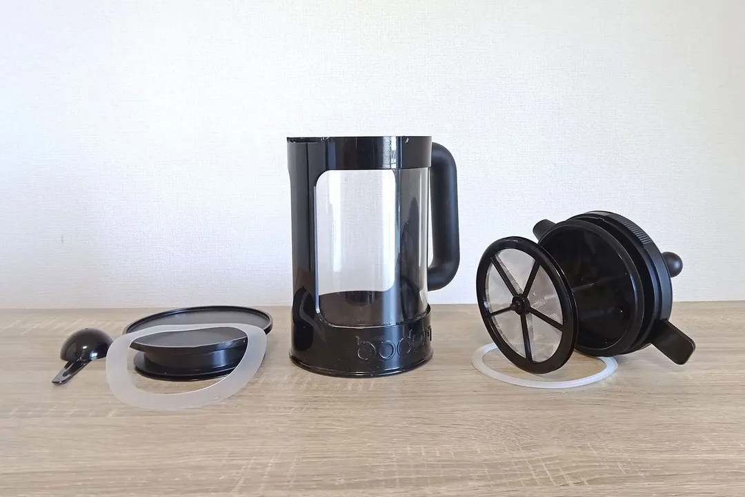 The disassembled Bodum cold brew coffee maker showing all six parts.