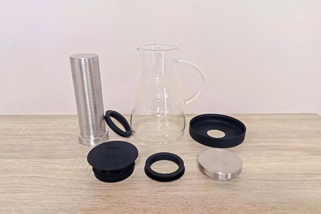 The fully disassembled Bean Envy cold brew coffee maker showing seven parts.