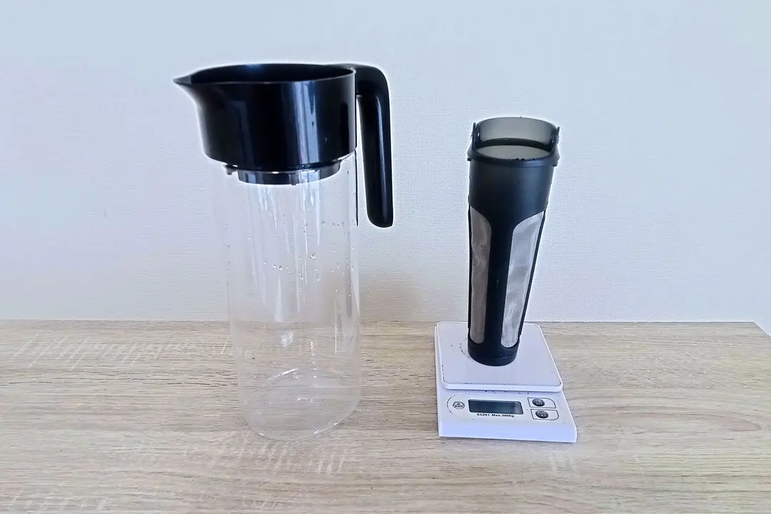 The Goodful cold brew coffee maker to the left and its filter filler with coffee ground on a scale to the right.
