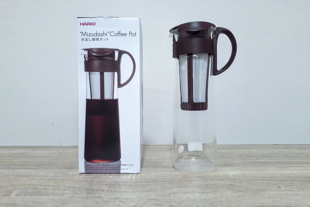 The Hario Mizudashi cold brew coffee maker standing to the right of its box.