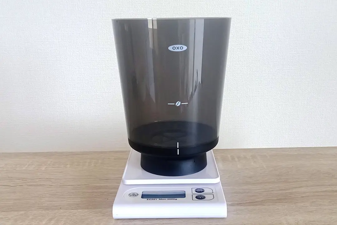 The brew vessel of the Oxo compact cold brew coffee maker resting on a measuring scale.