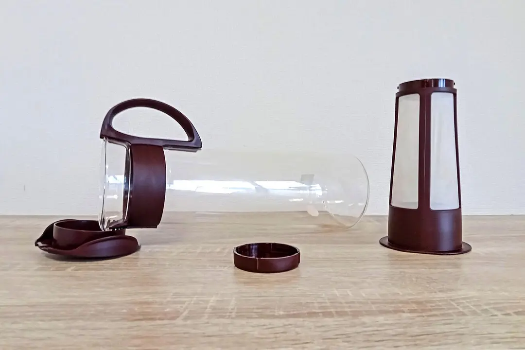 The Hario Mizudashi cold brew coffee carafe resting horizontally and separated into 4 parts.