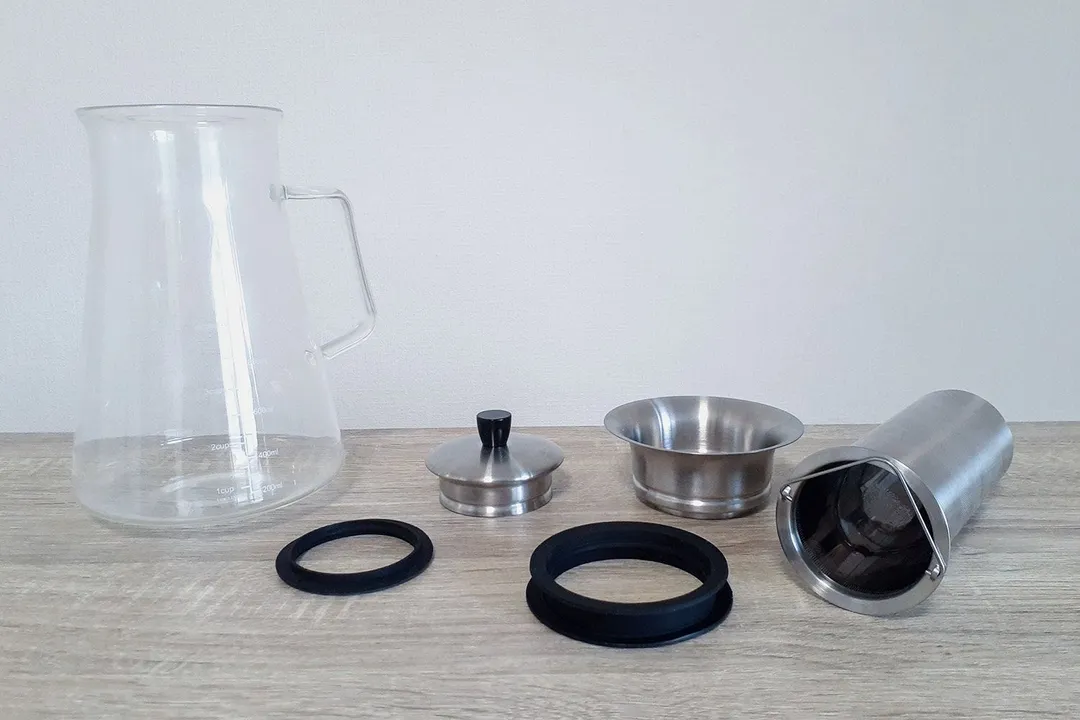 The Aquach cold brew coffee maker disassembled into its 6 components.