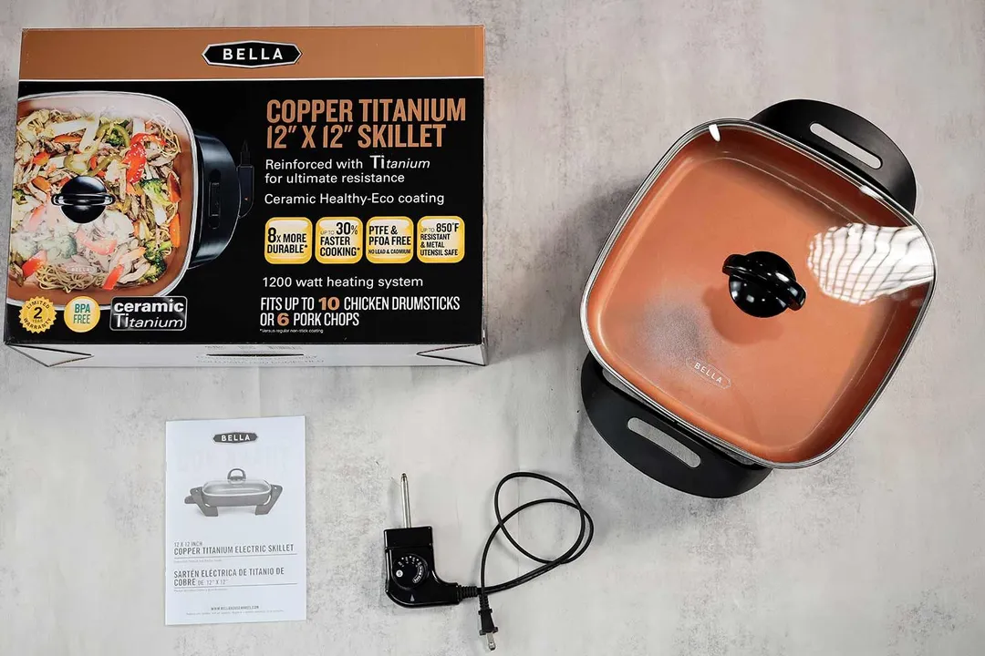 On the upper right is the Bella Non-Stick Electric Skillet 14607. On the left is its cardboard box. Below the skillet, on the right is a thermostat and on the left is an instruction manual.