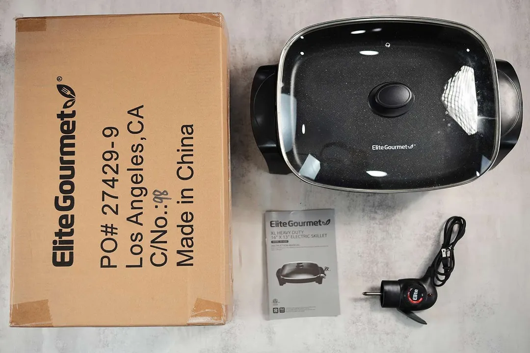 On the upper right is the  Elite Gourmet Electric Skillet EG-6203. On the left is its cardboard box. Below the skillet, on the right is a thermostat and on the left is an instruction manual.