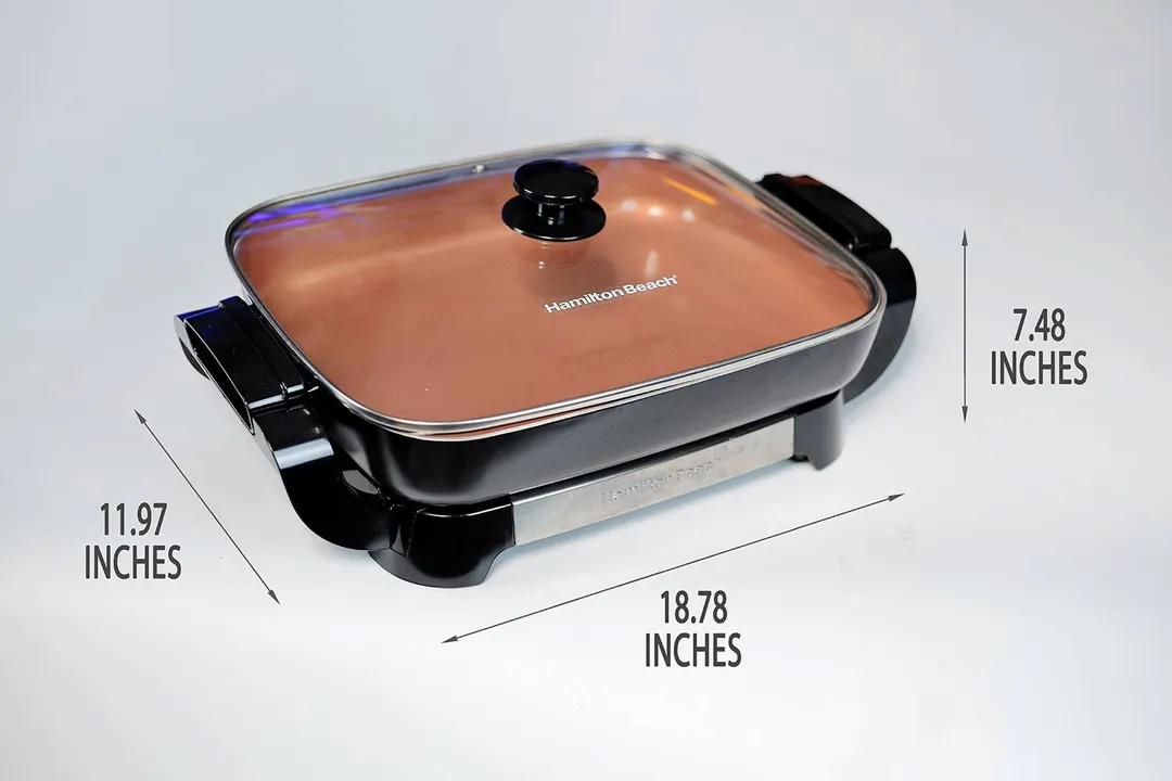 The Hamilton Beach Ceramic Non-Stick Electric Skillet 38529K is 18.78 inches in length, 11.97 inches in width, and 7.48 inches in height.