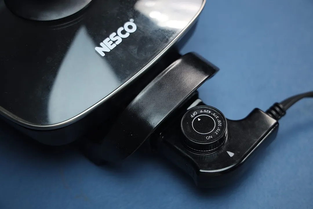 The Nesco Non-Stick Electric Skillet ES-08 with its thermostat inserted.