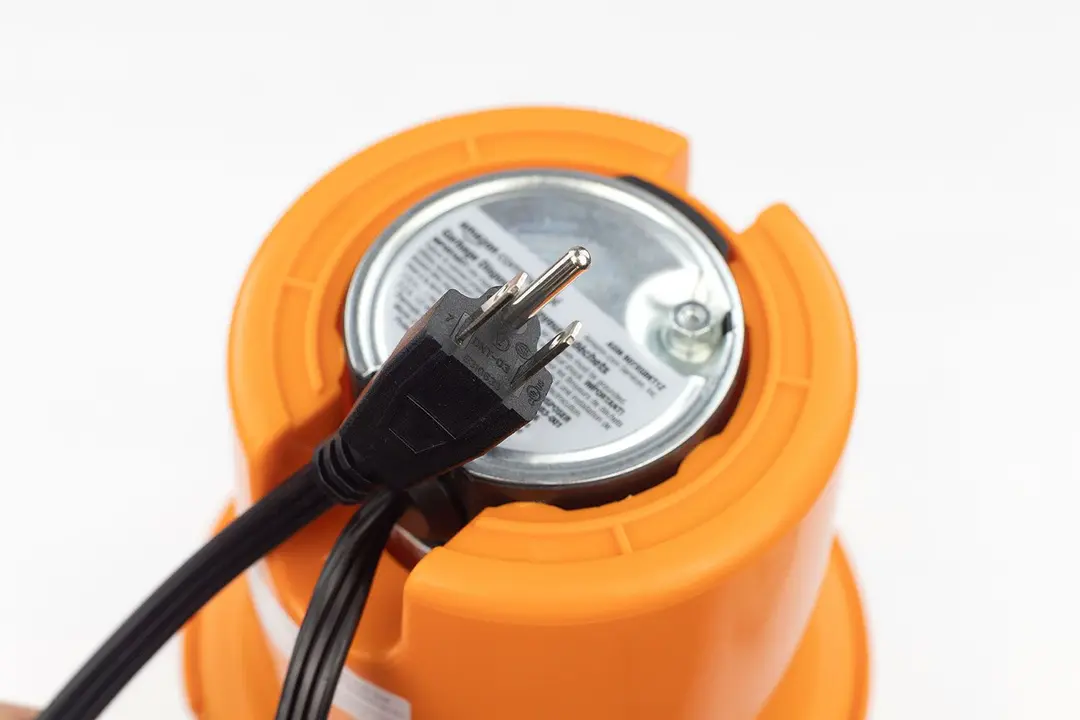 Bottom view of AmazonCommercial 1/2 HP corded garbage disposal with type-B power cord.