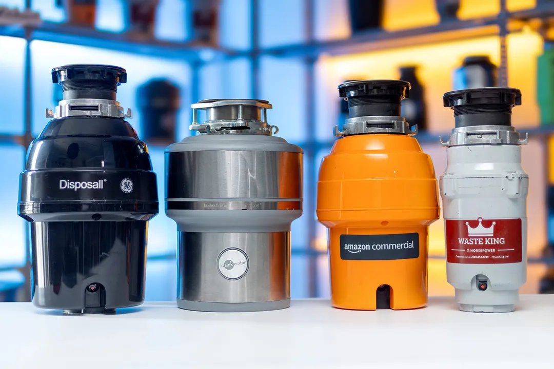Four Best garbage disposals, from left to right: the GE Disposall GFC720N 3/4-HP, the InSinkErator Evolution Excel 1-HP, the AmazonCommercial 3/4-HP, and the Waste King L-1001 1/2-HP.
