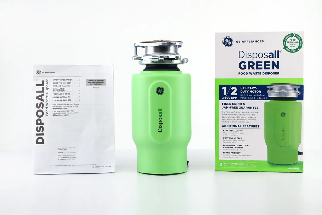 GE Disposall Green 1/2-Horsepower Garbage Disposal with 3-Bolt Mount assembly on top, its box, and user manual.