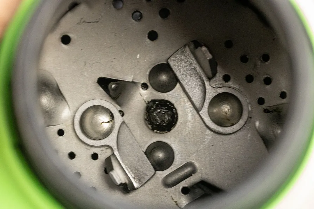 Top view into chamber of GE Disposall Green garbage disposal after testing, showing layout of grinding components.