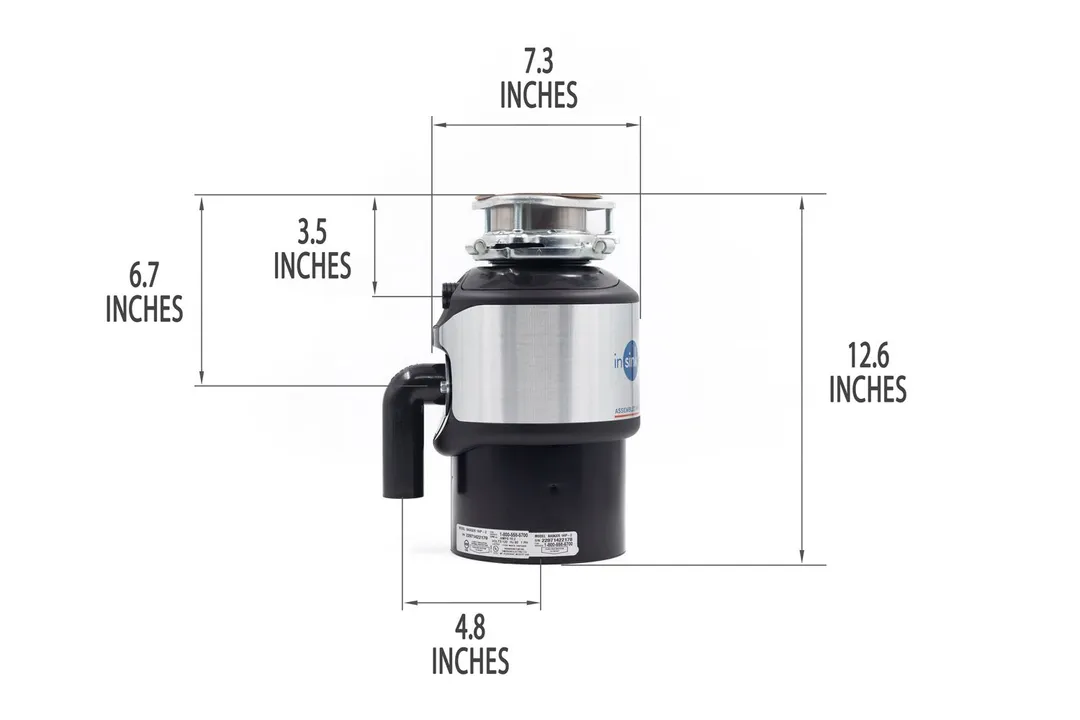Badger 1HP with mount assembly and elbow tube. Showing 7.3-inch width, 12.6-inch height, 3.5-inch depth to dishwasher outlet, 6.7-inch depth to outlet, 4.8-inch distance to elbow tube.