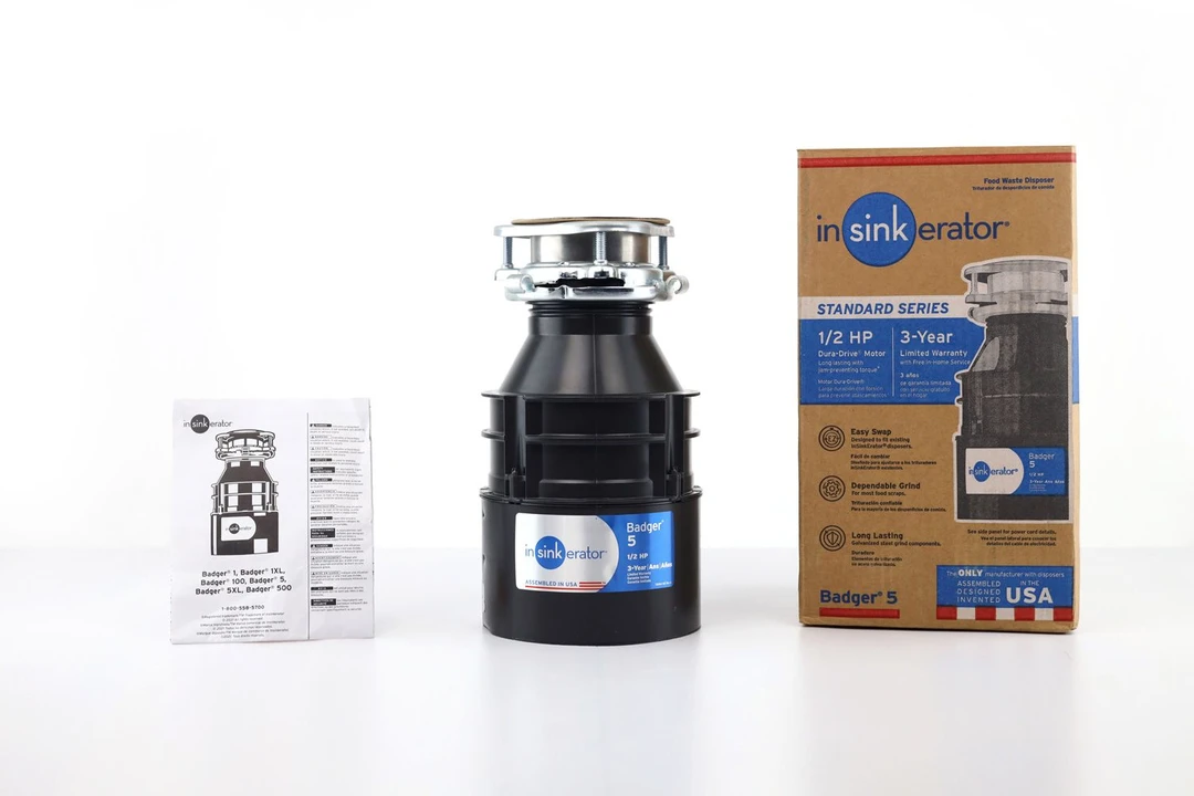 InSinkErator Badger 5 1/2 HP Continuous Feed Garbage Disposal, 3-Bolt Mount assembly on top, its box, and user manual.