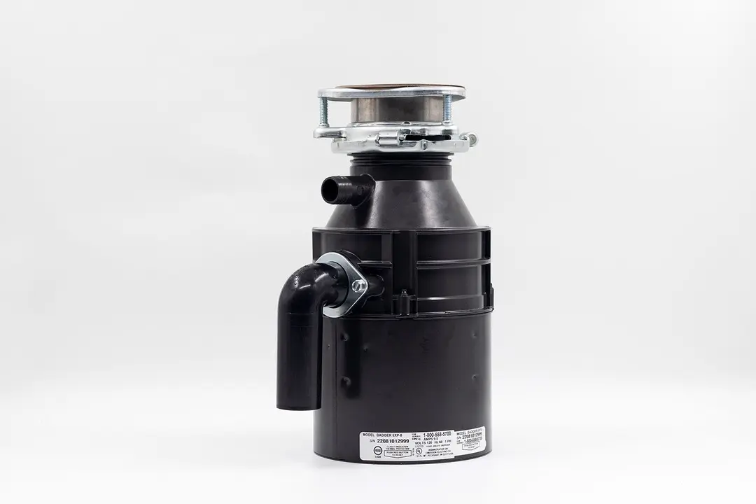 InSinkErator Badger 5XP 3/4 HP Garbage Disposal, with 3-Bolt Mount assembly on top and outlet/discharge set in place.