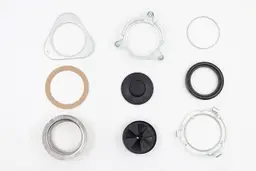 Parts of 3-Bolts Mount assembly on platform, including backup flange, mounting ring, snap ring, fiber gasket, stopper, cushion mount, sink flange with “food waste disposer” and “InSinkErator” engravings, removable sink baffle, lower mounting ring.