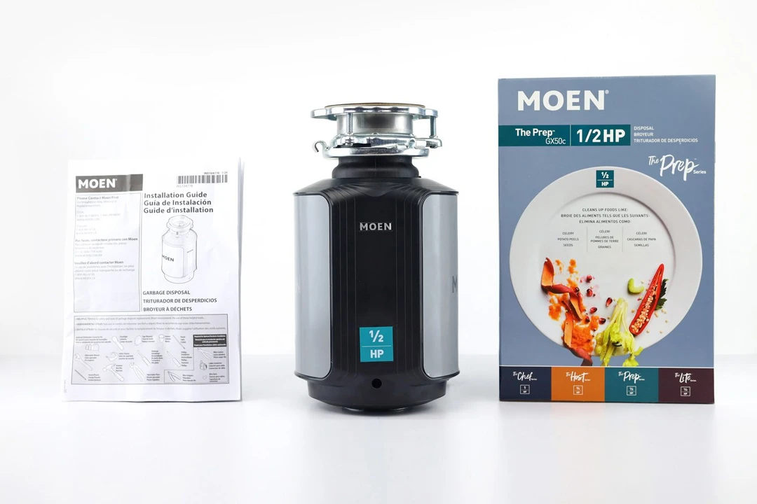 Moen GX50C GX Series Prep 1/2 Horsepower Garbage Disposal with 3-bolt mounting assembly on top, its box, and user manual.