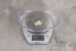 0.05 ounces of shredded dietary fiber on digital scale.