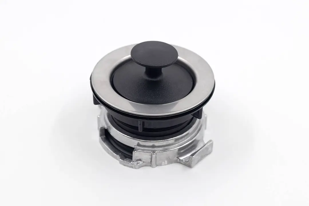EZ Mount assembly for garbage disposals placed on white platform with stopper in position.